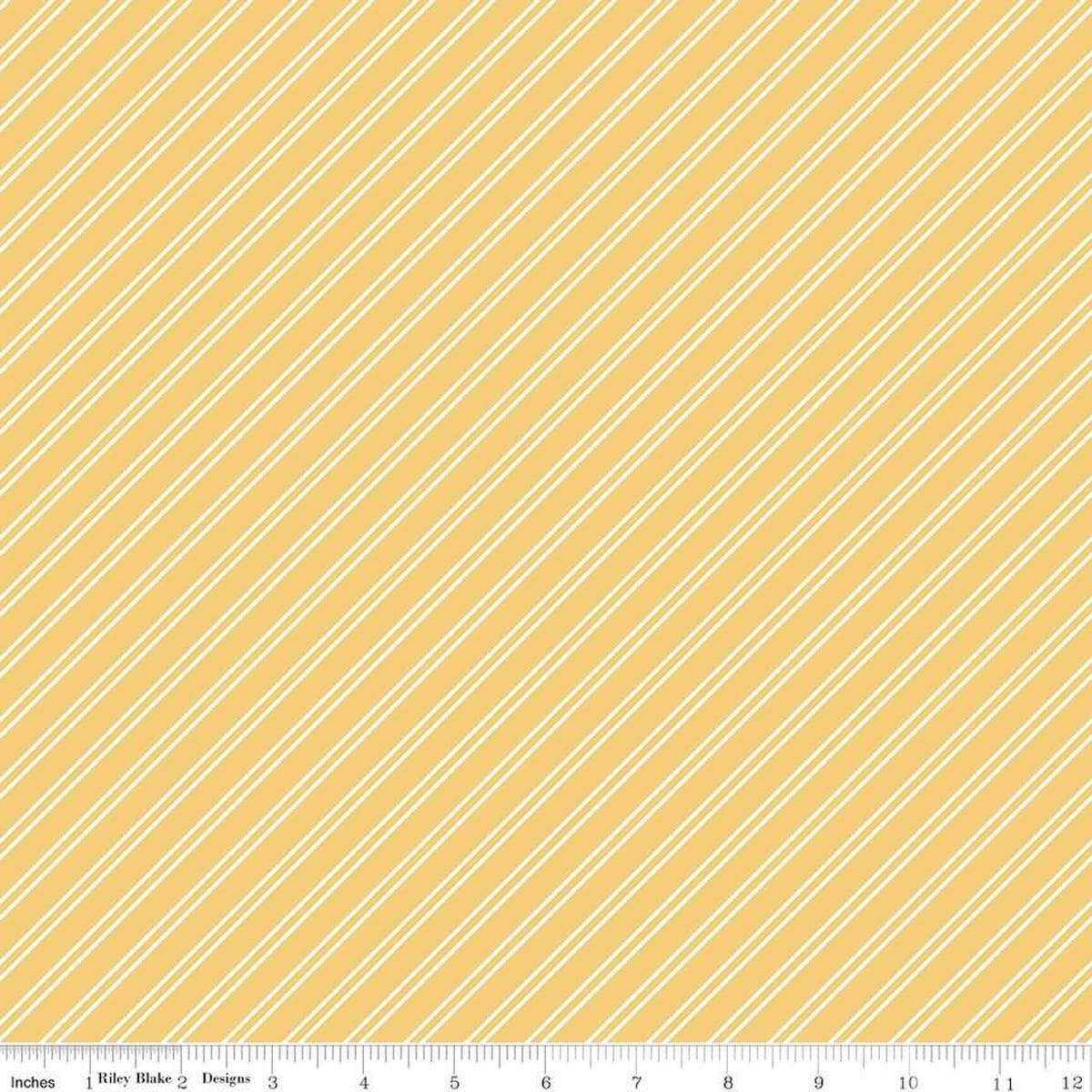 Image of the Between the Pages Stripes Honey quilting cotton fabric by Fran Gulick for Riley Blake Designs. Features diagonal small stripes on a light yellow background. 
Cute Little Fabric Shop
