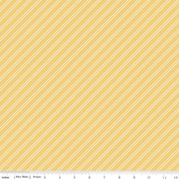 Image of the Between the Pages Stripes Honey quilting cotton fabric by Fran Gulick for Riley Blake Designs. Features diagonal small stripes on a light yellow background. 
Cute Little Fabric Shop