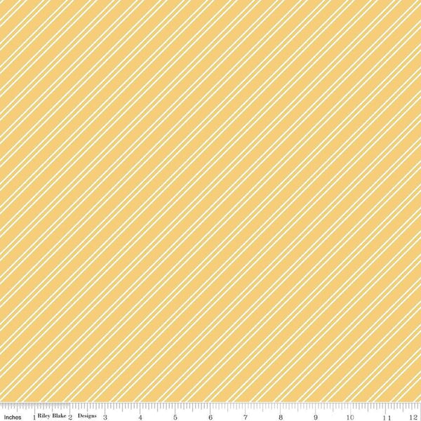 Image of the Between the Pages Stripes Honey quilting cotton fabric by Fran Gulick for Riley Blake Designs. Features diagonal small stripes on a light yellow background. 
Cute Little Fabric Shop
