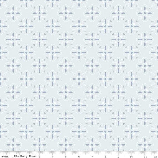 Image of the Between the Pages End Papers Iceberg quilting cotton fabric by Fran Gulick for Riley Blake Designs. Features a geometric medallion design on a pale blue background. 
Cute Little Fabric Shop