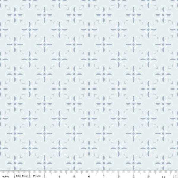 Image of the Between the Pages End Papers Iceberg quilting cotton fabric by Fran Gulick for Riley Blake Designs. Features a geometric medallion design on a pale blue background. 
Cute Little Fabric Shop
