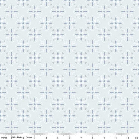 Image of the Between the Pages End Papers Iceberg quilting cotton fabric by Fran Gulick for Riley Blake Designs. Features a geometric medallion design on a pale blue background. 
Cute Little Fabric Shop