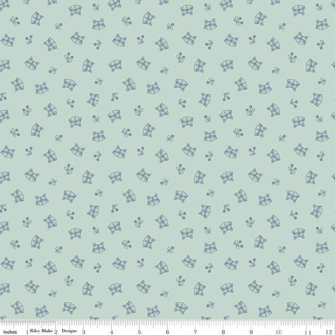 Image of the Twilight Creatures Raccoons Mint
 quilting cotton fabric by Natàlia Juan Abelló for Riley Blake Designs. Features scattered sprigs and raccoon heads on a light aqua background. 
Cute Little Fabric Shop