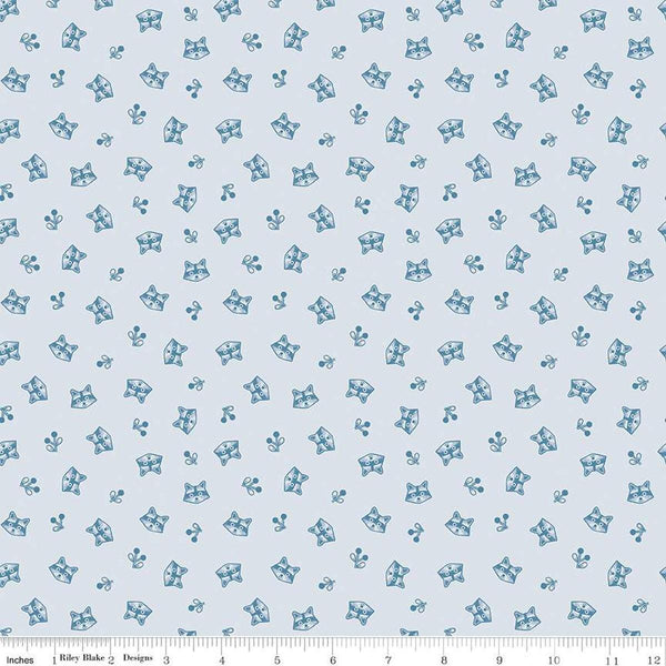 Image of the Twilight Creatures Raccoons Ice
 quilting cotton fabric by Natàlia Juan Abelló for Riley Blake Designs. Features scattered sprigs and raccoon heads on a pale blue background. 
Cute Little Fabric Shop