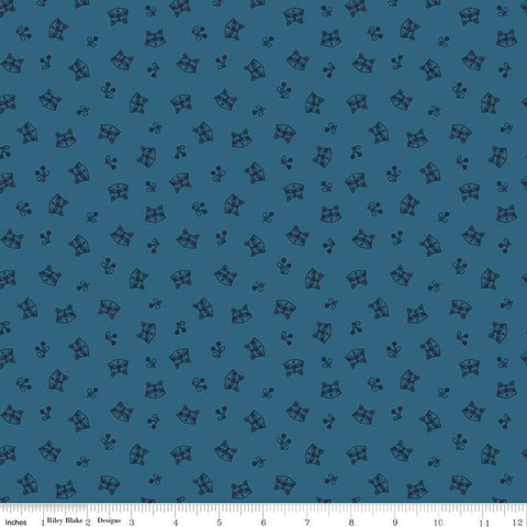 Image of the Twilight Creatures Raccoons Blue
 quilting cotton fabric by Natàlia Juan Abelló for Riley Blake Designs. Features scattered sprigs and raccoon heads on a dark blue background. 
Cute Little Fabric Shop