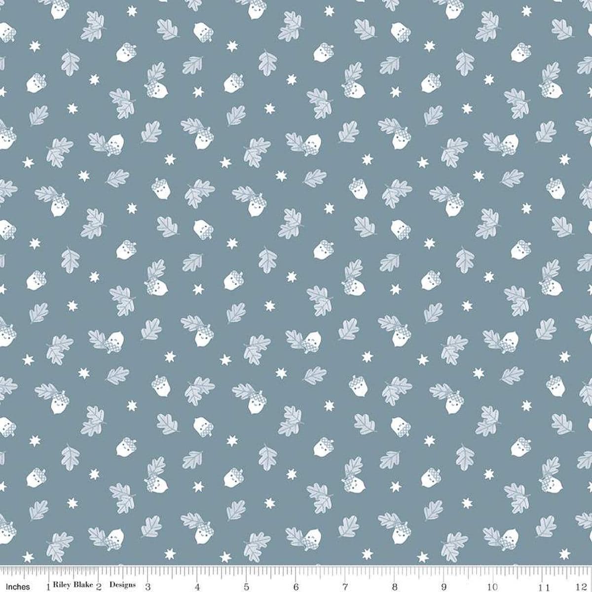 Image of the Twilight Creatures Happy Acorns Storm quilting cotton fabric by Natàlia Juan Abelló for Riley Blake Designs. Features small scattered acorns, stars, and leaves on a gray blue background. 
Cute Little Fabric Shop