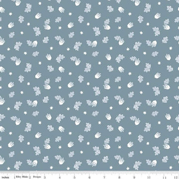 Image of the Twilight Creatures Happy Acorns Storm quilting cotton fabric by Natàlia Juan Abelló for Riley Blake Designs. Features small scattered acorns, stars, and leaves on a gray blue background. 
Cute Little Fabric Shop