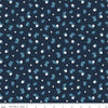 Image of the Twilight Creatures Happy Acorns Indigo quilting cotton fabric by Natàlia Juan Abelló for Riley Blake Designs. Features small scattered acorns, stars, and leaves on a dark blue background. 
Cute Little Fabric Shop