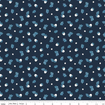 Image of the Twilight Creatures Happy Acorns Indigo quilting cotton fabric by Natàlia Juan Abelló for Riley Blake Designs. Features small scattered acorns, stars, and leaves on a dark blue background. 
Cute Little Fabric Shop