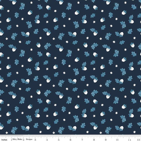 Image of the Twilight Creatures Happy Acorns Indigo quilting cotton fabric by Natàlia Juan Abelló for Riley Blake Designs. Features small scattered acorns, stars, and leaves on a dark blue background. 
Cute Little Fabric Shop