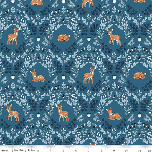 Image of the Twilight Creatures Wild Fawns Blue quilting cotton fabric by Natàlia Juan Abelló for Riley Blake Designs. Features a damask pattern with deer, leaves, acorns, and mushrooms on a dark blue background. 
Cute Little Fabric Shop