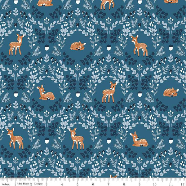 Image of the Twilight Creatures Wild Fawns Blue quilting cotton fabric by Natàlia Juan Abelló for Riley Blake Designs. Features a damask pattern with deer, leaves, acorns, and mushrooms on a dark blue background. 
Cute Little Fabric Shop