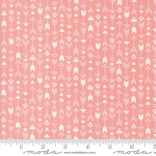 Image of the Love Blooms Arrow Blush quilting cotton fabric by Moda Fabrics. Features arrows on a pink background. Cute Little Fabric Shop