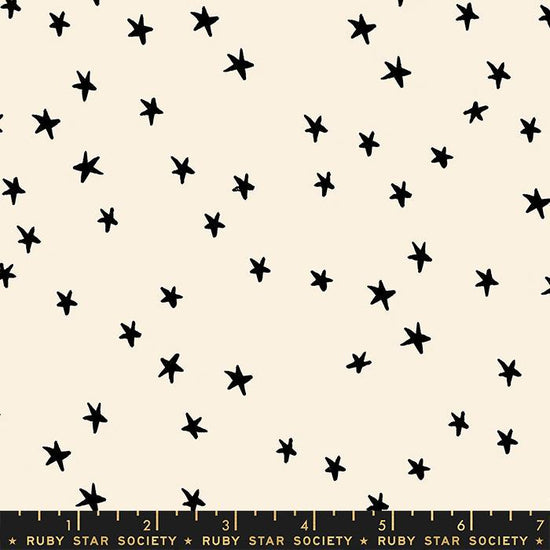 Image of the Starry Blenders Star Natural quilting cotton fabric by Alexia Abegg for Moda Fabrics. Features small scattered stars on a cream background. Cute Little Fabric Shop