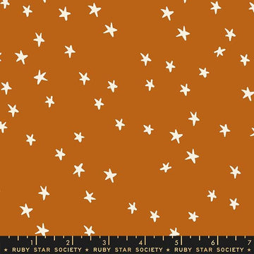 Image of the Starry Blenders Star Saddle quilting cotton fabric by Alexia Abegg for Moda Fabrics. Features small scattered stars on an orange background. Cute Little Fabric Shop
