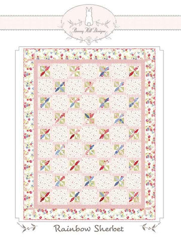 Image of the Rainbow Sherbet quilt pattern by Anne Sutton for Moda Fabrics. Features a quilt with pink and floral fabrics. 
Cute Little Fabric Shop