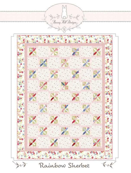 Image of the Rainbow Sherbet quilt pattern by Anne Sutton for Moda Fabrics. Features a quilt with pink and floral fabrics. 
Cute Little Fabric Shop