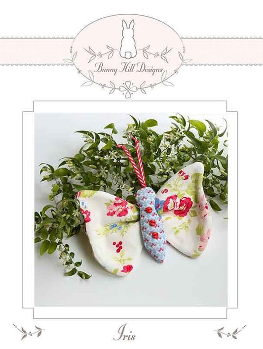 Image of the Iris quilt pattern by Bunny Hill Design for Moda Fabrics. Features a butterfly made out of floral fabrics. 
Cute Little Fabric Shop