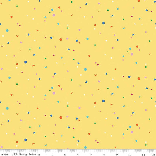 Image of the Celebrate Confetti Yellow
 quilting cotton fabric by Sue Daley for Riley Blake Designs. Features brightly colored dots and crescent moons on a yellow background.
Cute Little Fabric Shop