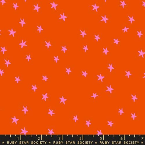 Image of the Starry Blenders Star Warm Red quilting cotton fabric by Alexia Abegg for Moda Fabrics. Features small scattered stars on a red background. Cute Little Fabric Shop