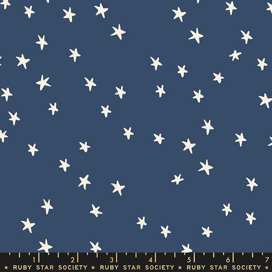 Image of the Starry Blenders Star Bluebell quilting cotton fabric by Alexia Abegg for Moda Fabrics. Features small scattered stars on a blue background. Cute Little Fabric Shop