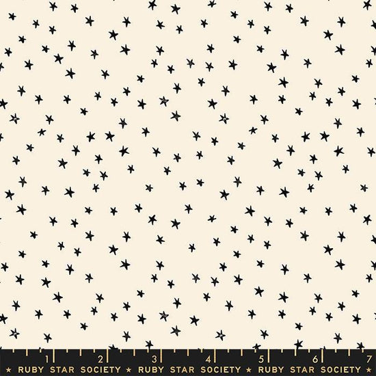 Image of the Starry Blenders Star Natural quilting cotton fabric by Alexia Abegg for Moda Fabrics. Features small scattered stars on a cream background. Cute Little Fabric Shop