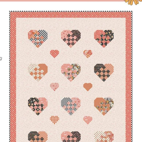 Image of the Holding Hearts quilt pattern by Frannie B Quilting Co for Riley Blake Designs. Features hearts on a quilt. 
Cute Little Fabric Shop