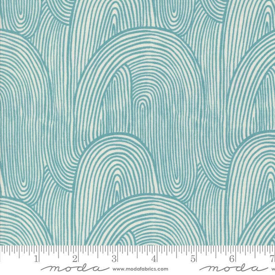 Image of the Things Above Wavy Teal quilting cotton fabric by Fancy That Design House for Moda Fabrics. Features wavy lines on a blue background. Cute Little Fabric Shop