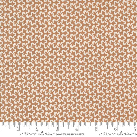 Image of the Portofino Tiles Sierra quilting cotton fabric by Fig Tree Co for Riley Blake Designs. Features abstract swirls on a brown background. Cute Little Fabric Shop