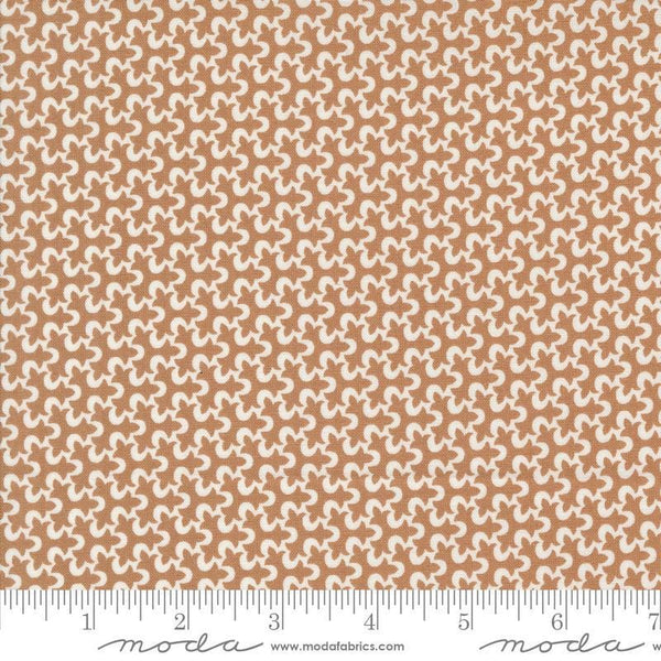 Image of the Portofino Tiles Sierra quilting cotton fabric by Fig Tree Co for Riley Blake Designs. Features abstract swirls on a brown background. Cute Little Fabric Shop