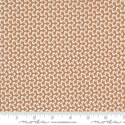 Image of the Portofino Tiles Sierra quilting cotton fabric by Fig Tree Co for Riley Blake Designs. Features abstract swirls on a brown background. Cute Little Fabric Shop