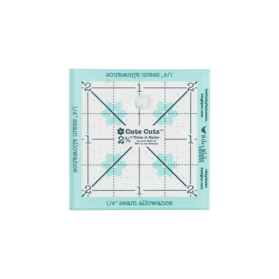 Image of the Cute Cuts™ Trim-it Ruler 2 3/4 inch x 2 3/4 inch by Lori Holt by Riley Blake Designs. Features a non-slip small plastic ruler. 
Cute Little Fabric Shop