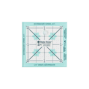 Image of the Cute Cuts™ Trim-it Ruler 2 3/4 inch x 2 3/4 inch by Lori Holt by Riley Blake Designs. Features a non-slip small plastic ruler. 
Cute Little Fabric Shop