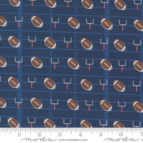 Image of the Play Ball Football Navy quilting cotton fabric by Moda Fabrics. Features novelty goal posts and footballs on a dark blue background. 
Cute Little Fabric Shop