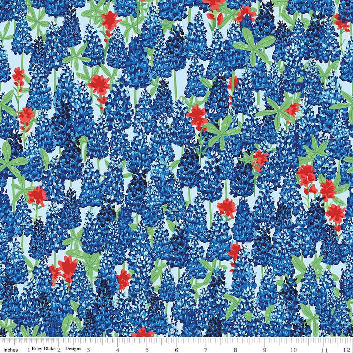 Image of the Friendship Florals Main Sky
 quilting cotton fabric by Diane Labombarbe for Riley Blake Designs. Features a field of bluebonnet flowers on a blue background.
Cute Little Fabric Shop