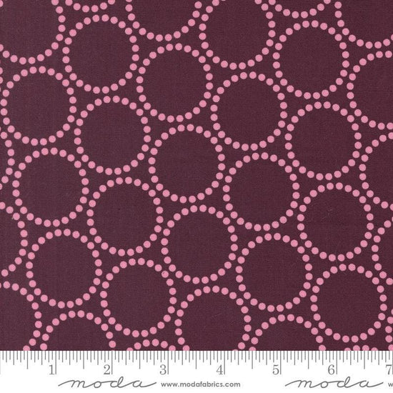 Image of the Love Letter Dots Merlot quilting cotton fabric by Lizzy House for Moda Fabrics. Features dotted circles on a purple background. Cure Little Fabric Shop