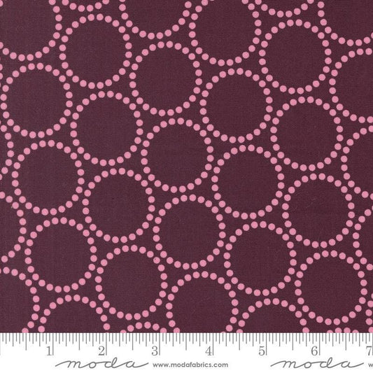 Image of the Love Letter Dots Merlot quilting cotton fabric by Lizzy House for Moda Fabrics. Features dotted circles on a purple background. Cure Little Fabric Shop