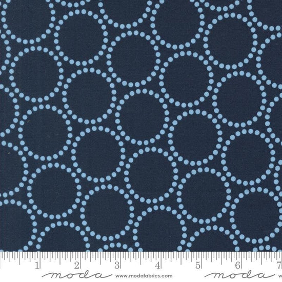 Image of the Love Letter Dots Peacoat quilting cotton fabric by Lizzy House for Moda Fabrics. Features dotted circles on a blue background. Cure Little Fabric Shop