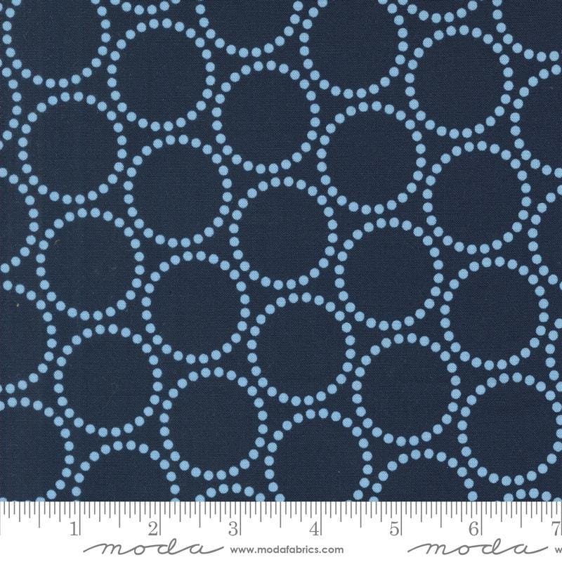 Image of the Love Letter Dots Peacoat quilting cotton fabric by Lizzy House for Moda Fabrics. Features dotted circles on a blue background. Cure Little Fabric Shop