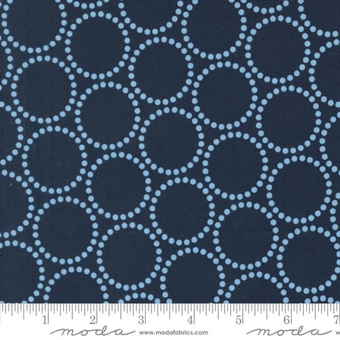 Image of the Love Letter Dots Peacoat quilting cotton fabric by Lizzy House for Moda Fabrics. Features dotted circles on a blue background. Cure Little Fabric Shop