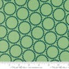 Image of the Love Letter Dots Cucumber quilting cotton fabric by Lizzy House for Moda Fabrics. Features dotted circles on a green background. Cure Little Fabric Shop
