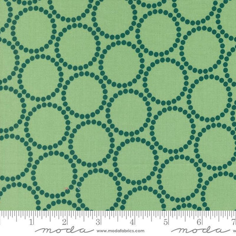 Image of the Love Letter Dots Cucumber quilting cotton fabric by Lizzy House for Moda Fabrics. Features dotted circles on a green background. Cure Little Fabric Shop