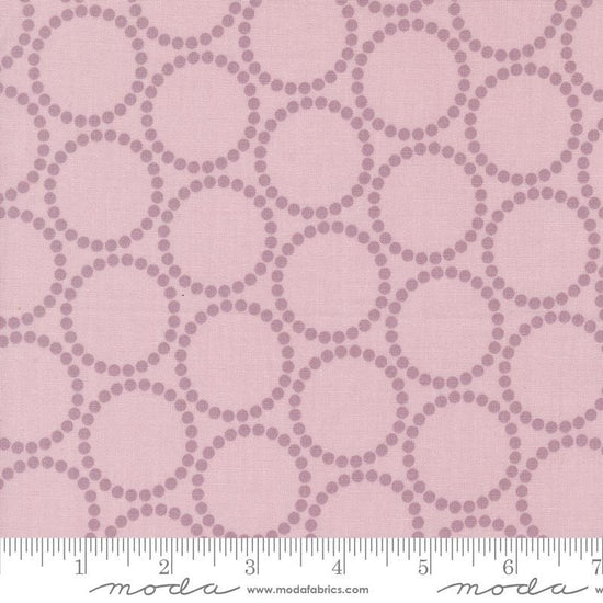 Image of the Love Letter Dots Mauve quilting cotton fabric by Lizzy House for Moda Fabrics. Features dotted circles on a pink background. Cure Little Fabric Shop