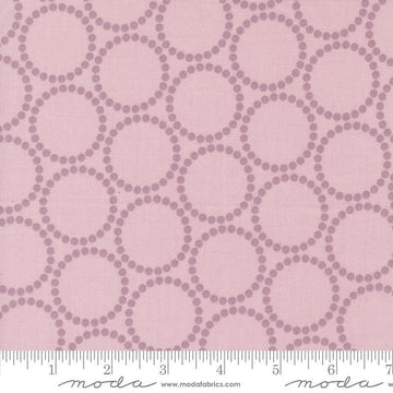 Image of the Love Letter Dots Mauve quilting cotton fabric by Lizzy House for Moda Fabrics. Features dotted circles on a pink background. Cure Little Fabric Shop