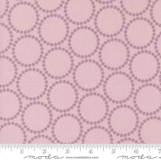 Image of the Love Letter Dots Mauve quilting cotton fabric by Lizzy House for Moda Fabrics. Features dotted circles on a pink background. Cure Little Fabric Shop