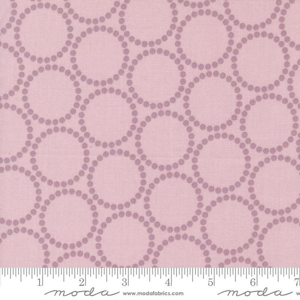Image of the Love Letter Dots Mauve quilting cotton fabric by Lizzy House for Moda Fabrics. Features dotted circles on a pink background. Cure Little Fabric Shop