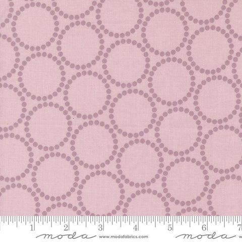 Image of the Love Letter Dots Mauve quilting cotton fabric by Lizzy House for Moda Fabrics. Features dotted circles on a pink background. Cure Little Fabric Shop