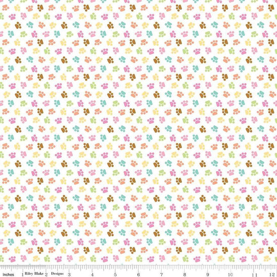 Image of the Pretty Kitty™ Paws White quilting cotton fabric by Doodlebug Design Inc for Riley Blake Designs. Features small paws on a white background. Cute Little Fabric Shop