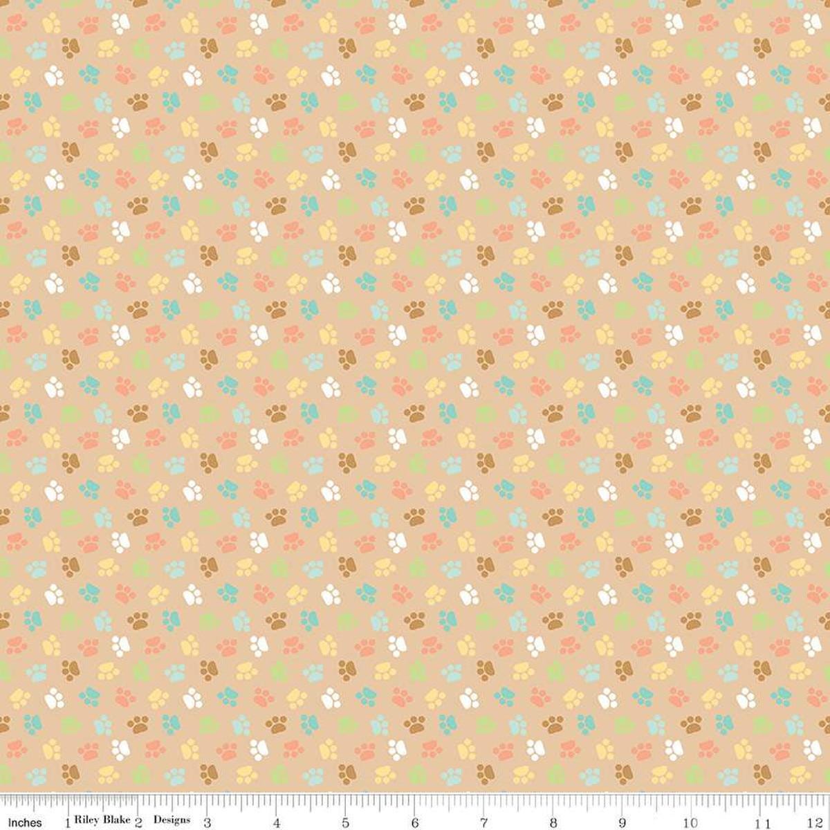 Image of the Pretty Kitty™ Paws Tan quilting cotton fabric by Doodlebug Design Inc for Riley Blake Designs. Features small paws on a tan background. Cute Little Fabric Shop