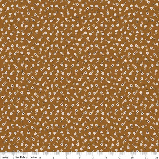 Blush 'n Butterscotch Ditsy Floral Cinnamon quilting cotton fabric by Simple Simon & Company for Riley Blake Designs. Features small flowers on a brown background. Cute Little Fabric Shop